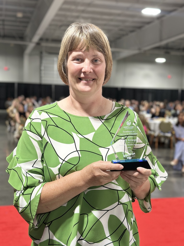 Award Recipient poses with trophy
