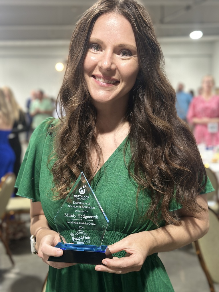 Award Recipient poses with trophy