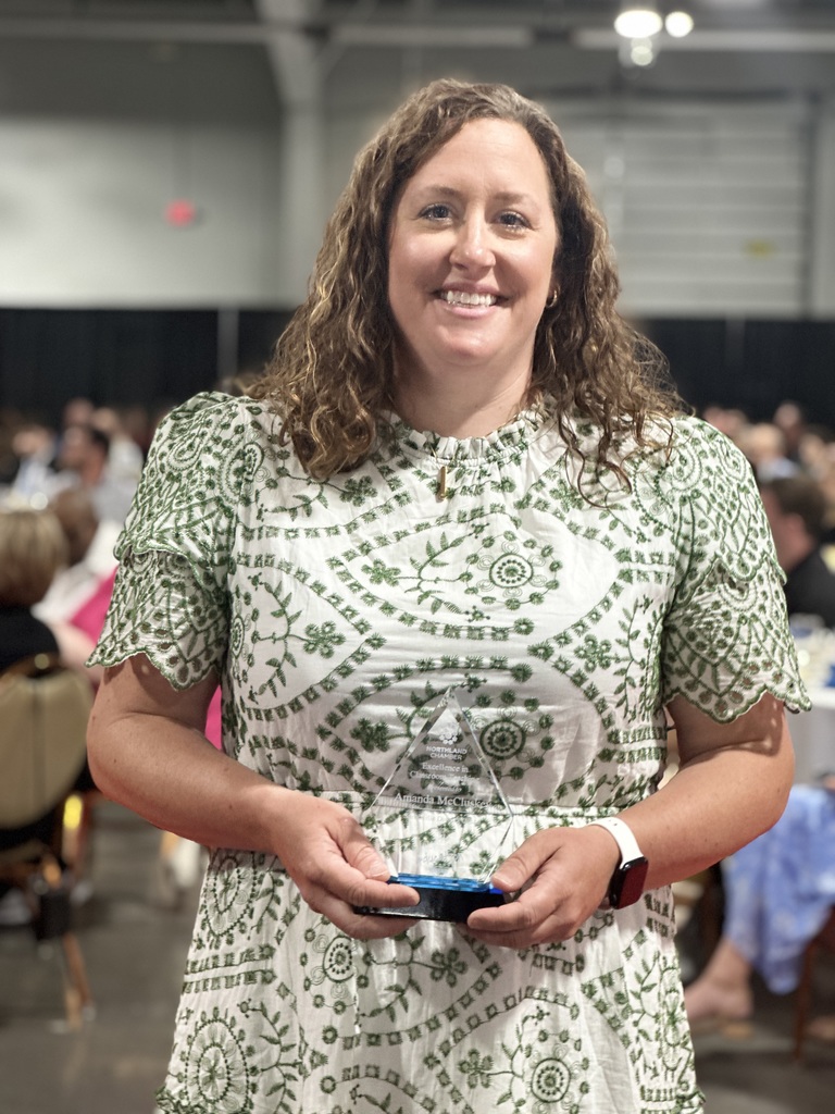 Award Recipient poses with trophy
