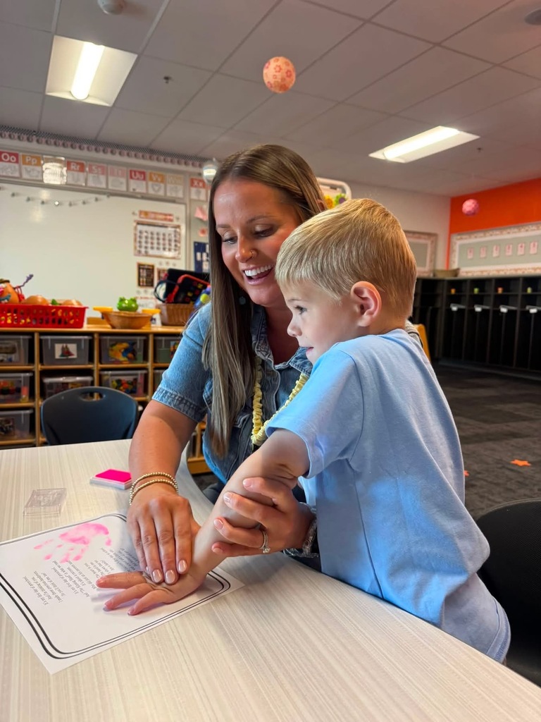 Preschooler working with teacher