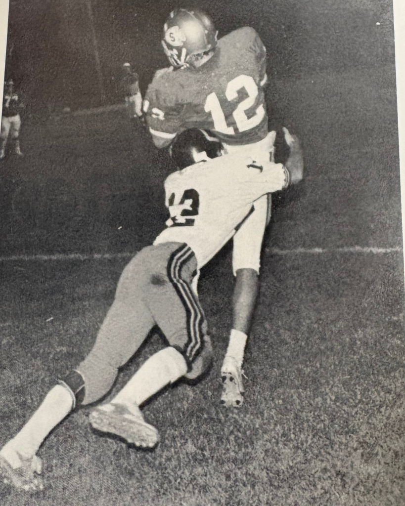 this is Kelly Ewards catching the football with a Cameron defender tackling him 