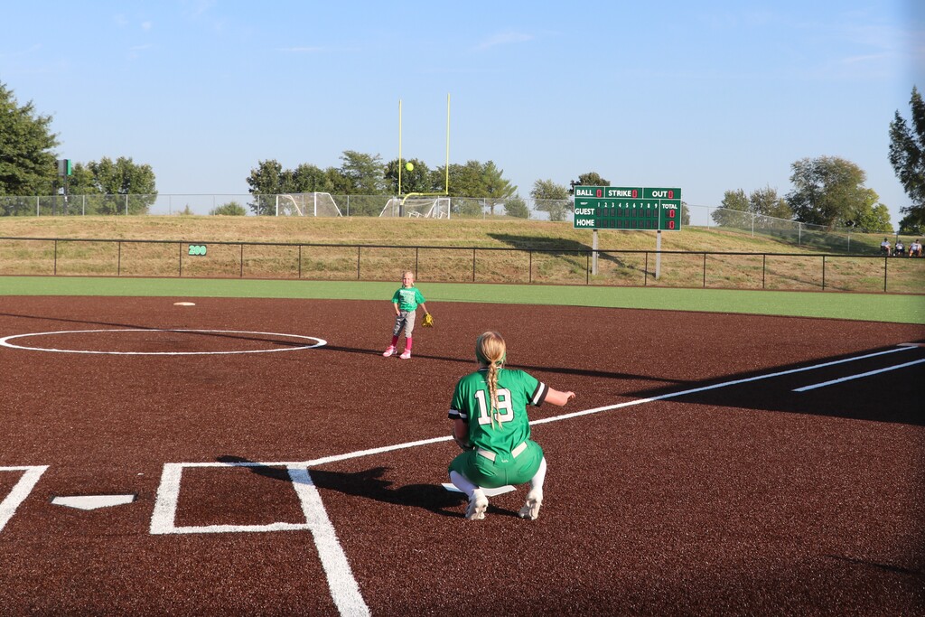 The pitcher representing the future throws her first pitch