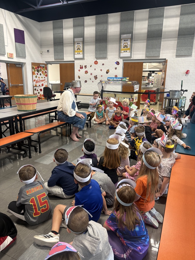 Johnny reading to students.