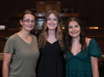 Three girls pose for a picture at the Cooperative Youth Conference & Leadership Experience