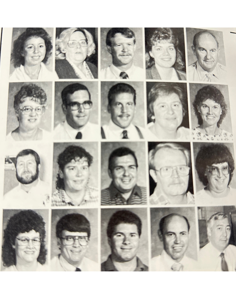 A 1988 black and white yearbook photo of teachers and staff smiling for their photo.