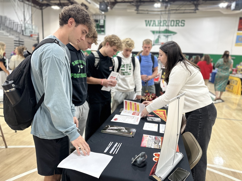 Students speak to the representative from Pitt State.