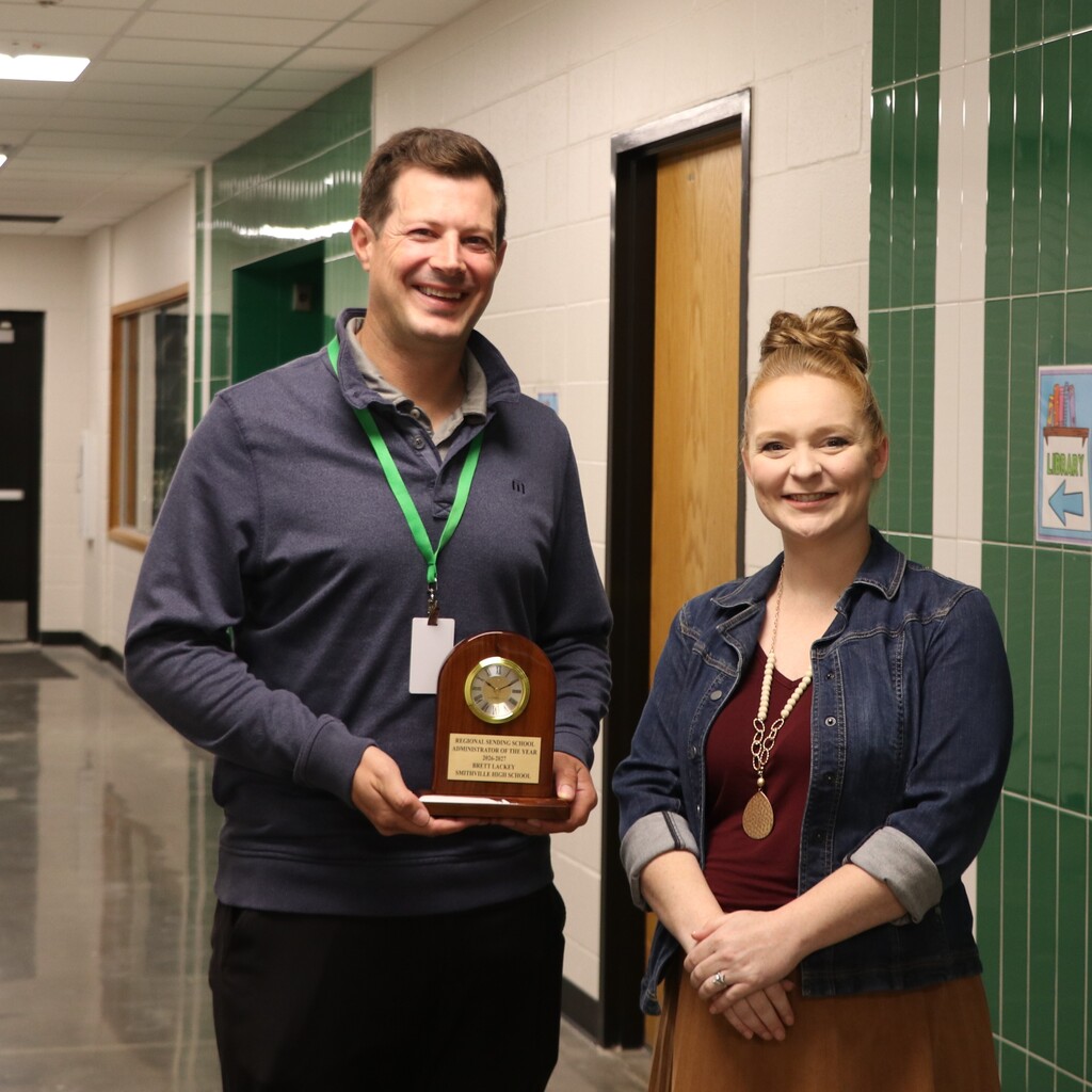 Dr. Lack and Megan Drummond pose for a picture with his award.