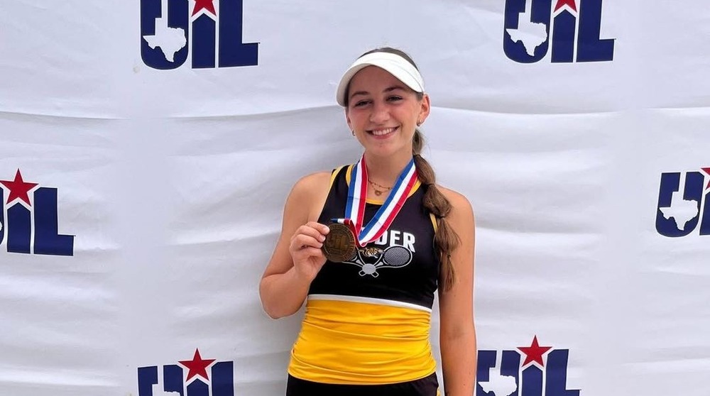 sarah posing with medal 