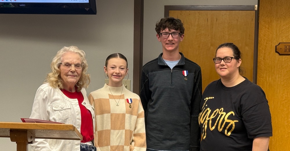 june isbell, brantley mckay, knox morris, aheather mccormick pose for photo