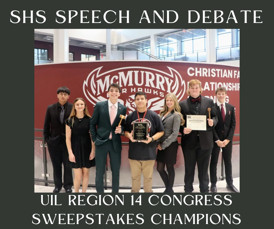 photo of students posing with trophy
