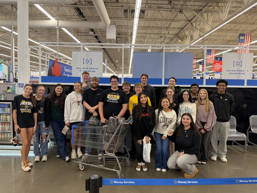 students posing with empty basket