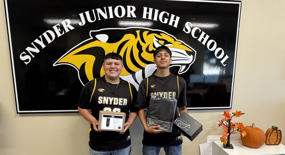students posing with prizes