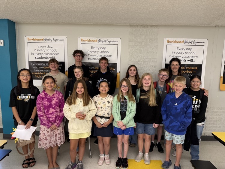 students posing with superintendent