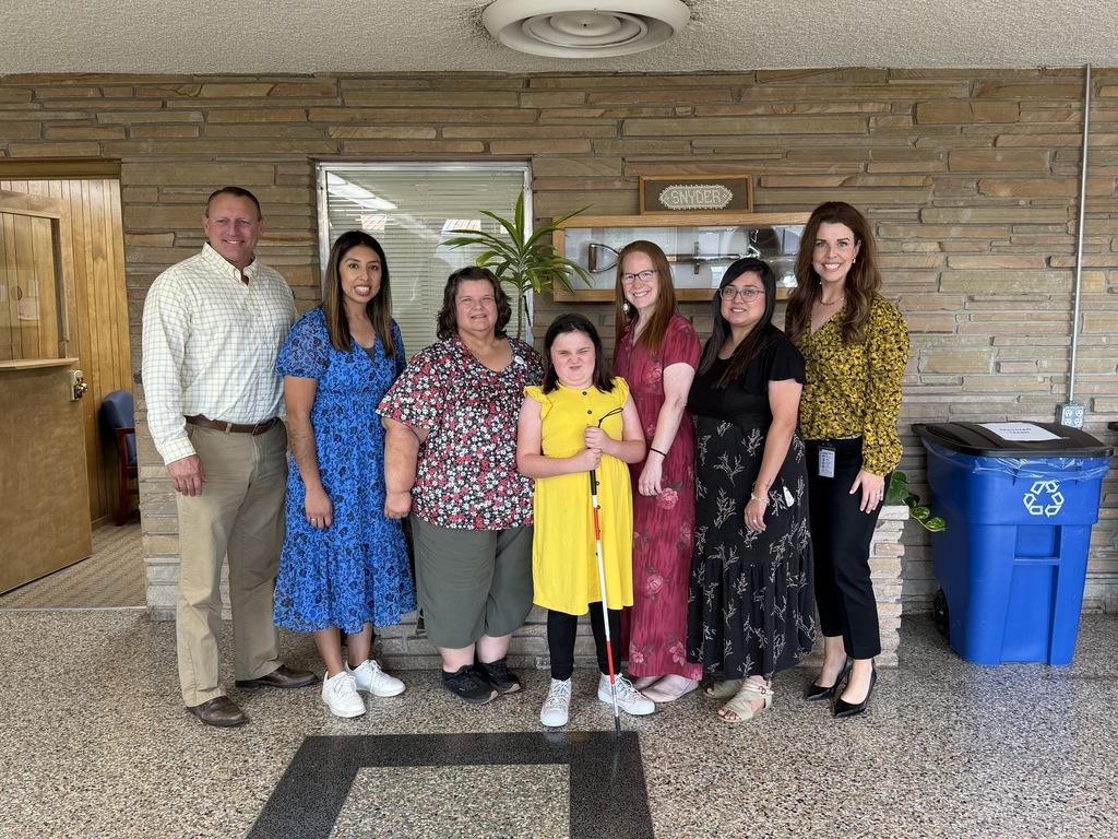 student with teachers and administration 