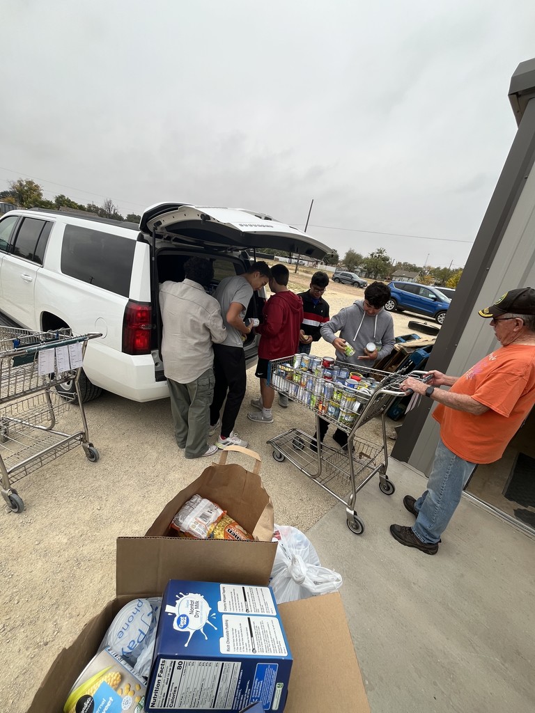 students unloading items
