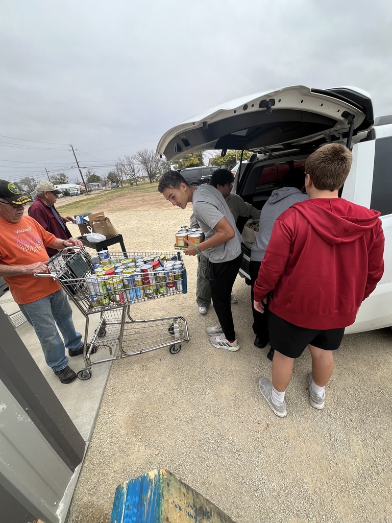 students unloading canned goods