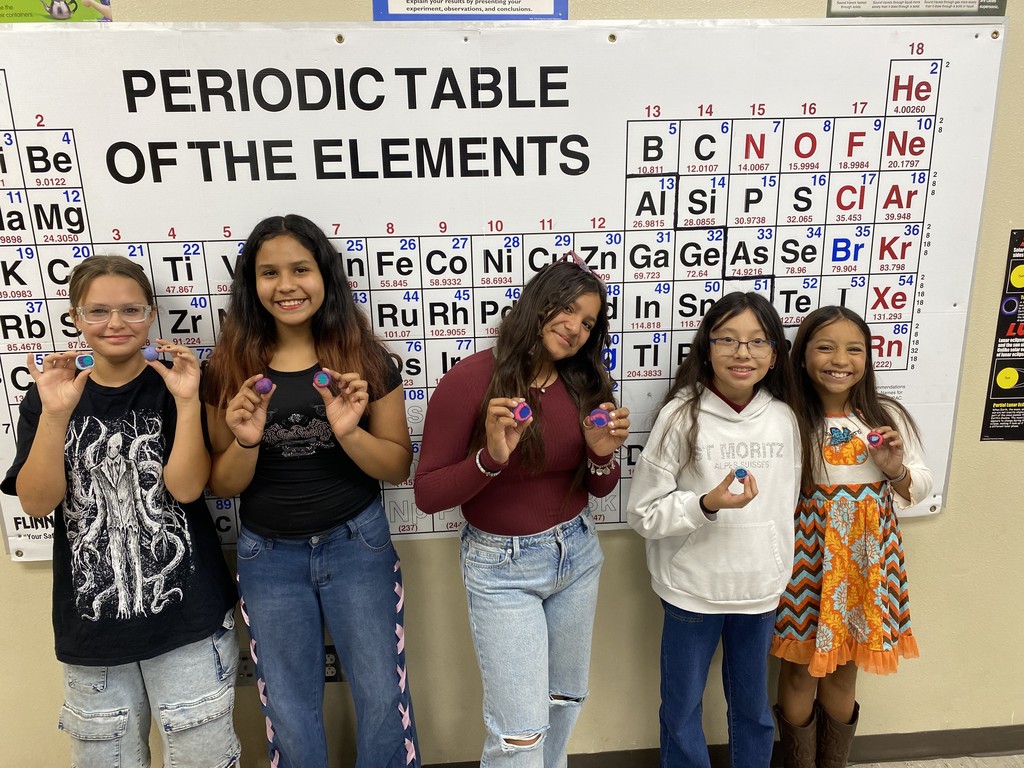 students showing off their playdoh planets