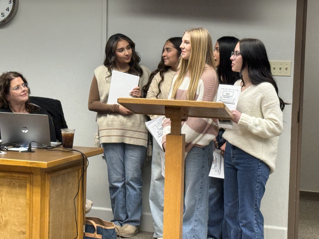 students presenting to the board