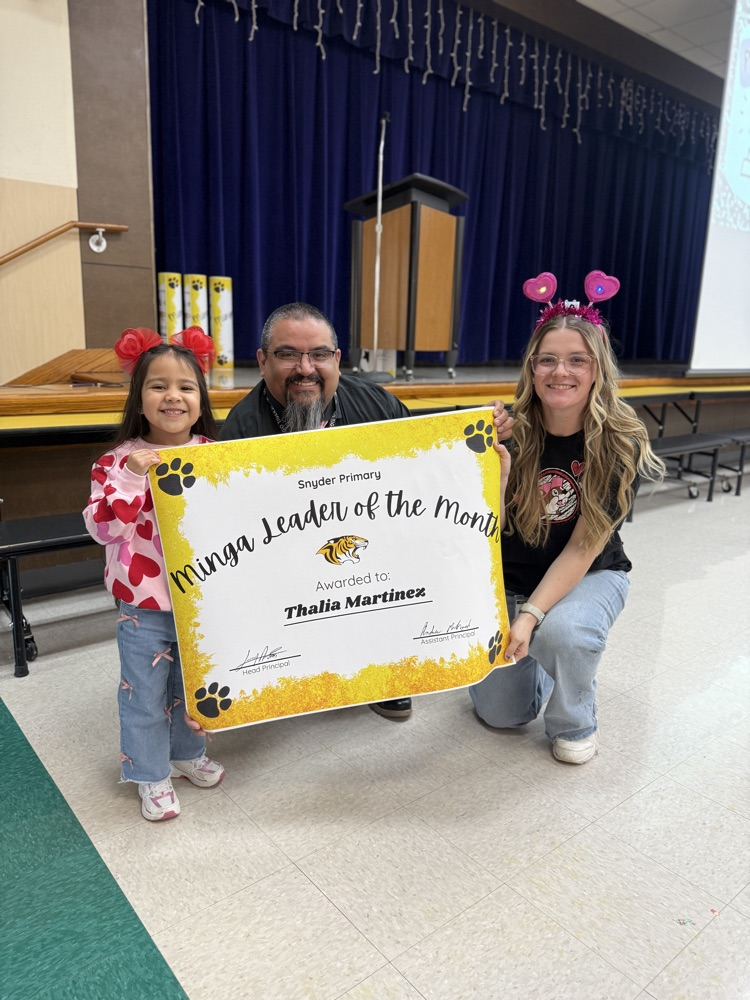 minga leader of the month posing with principal and counselor