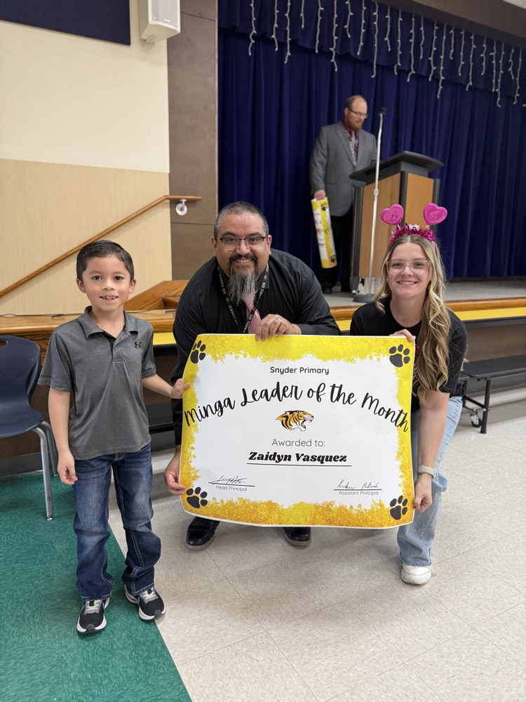 minga leader of the month posing with principal and counselor