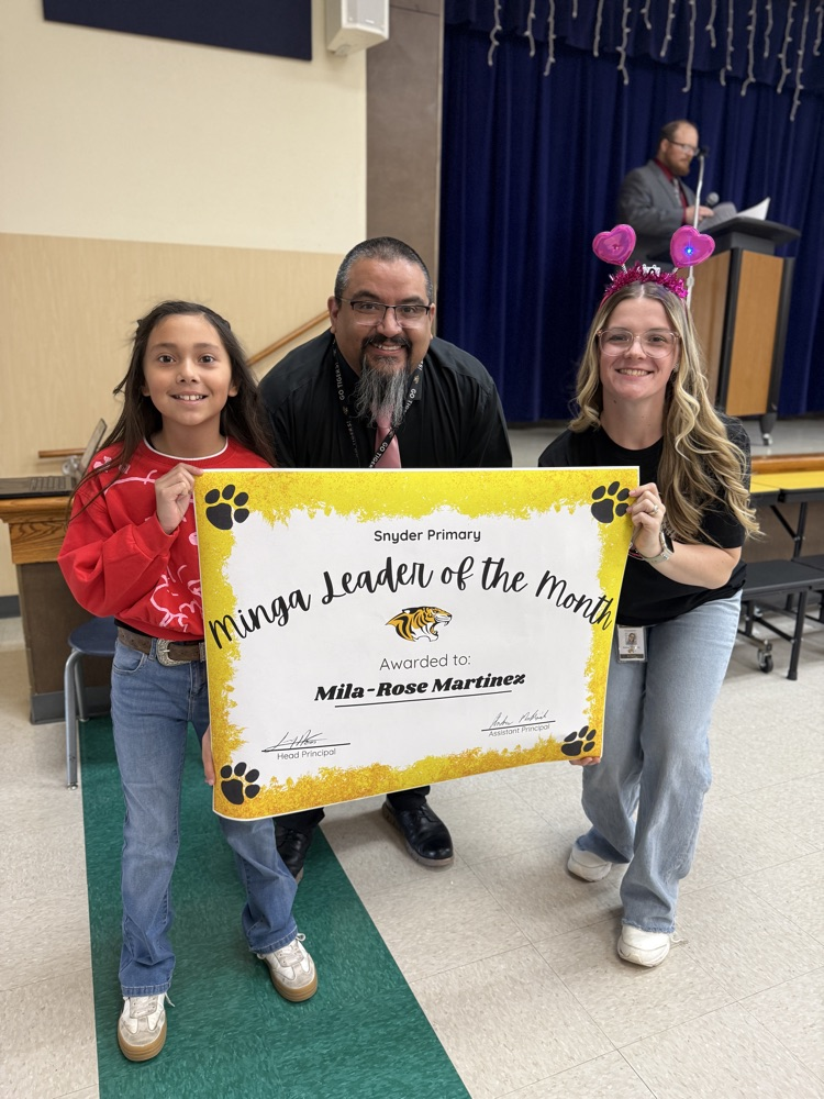minga leader of the month posing with principal and counselor
