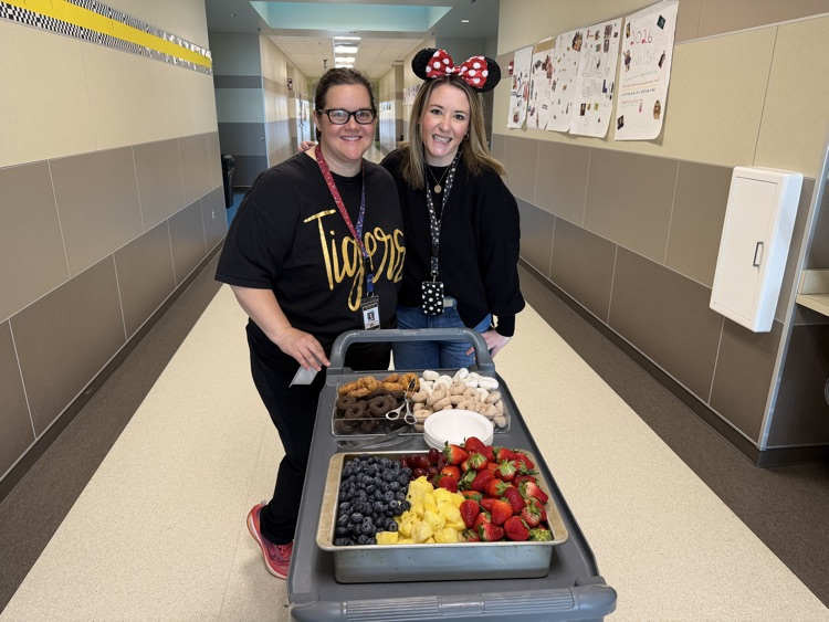 staff posing with instructional staff and mini treats