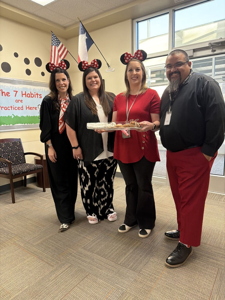 staff posing with instructional staff and mini treats