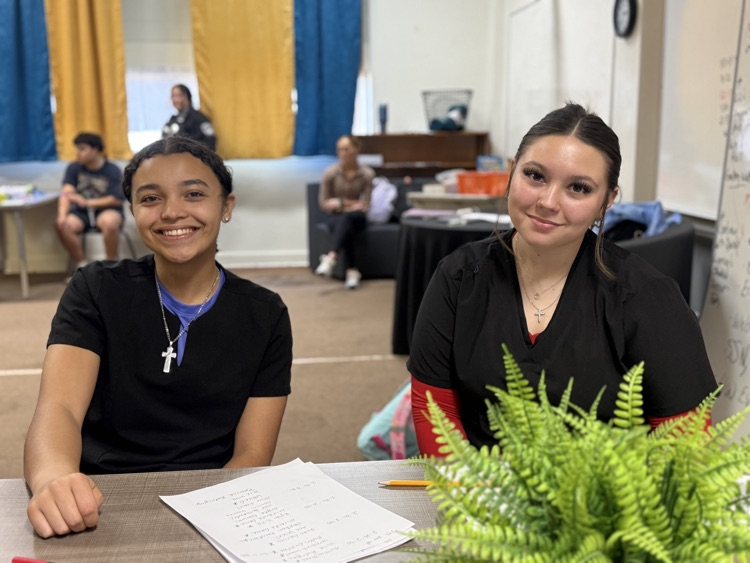 Photo of phlebotomy students welcoming guests