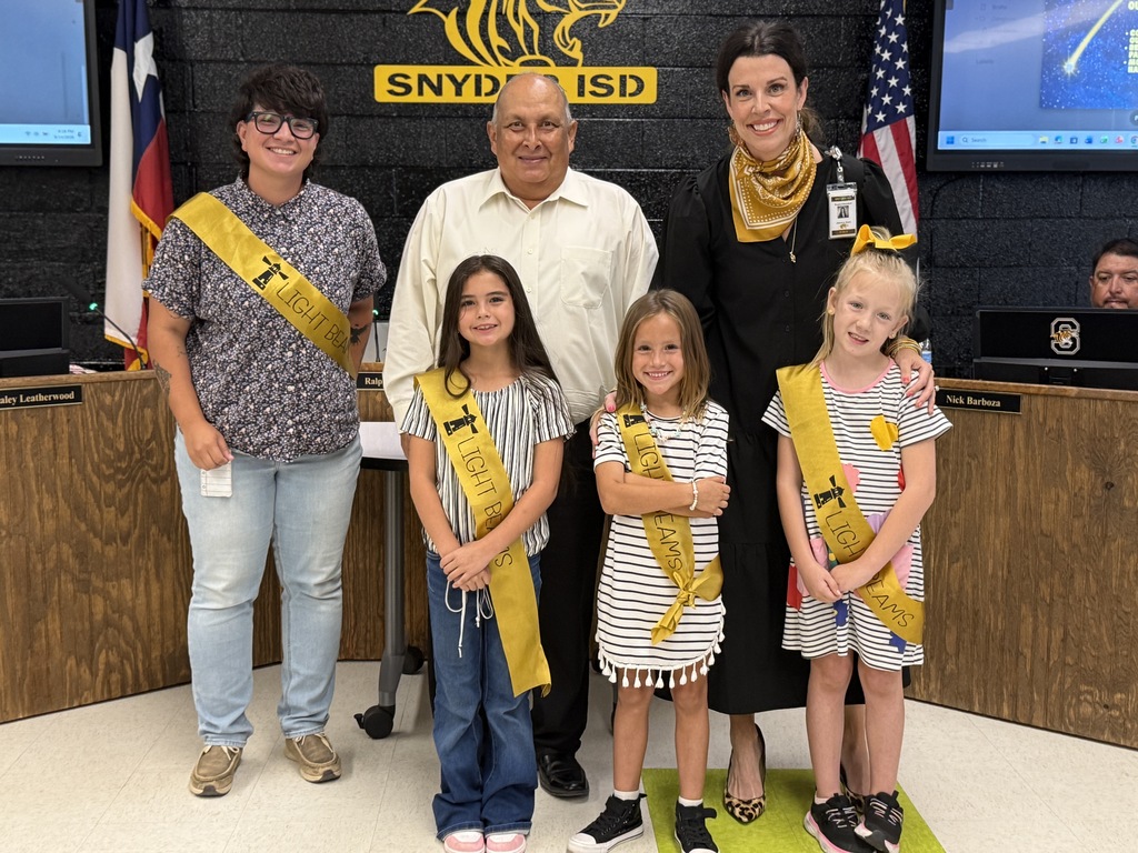 board presedent, dr. gore and mrs. porta posing with students