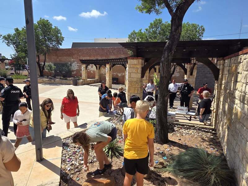 students placing rocks