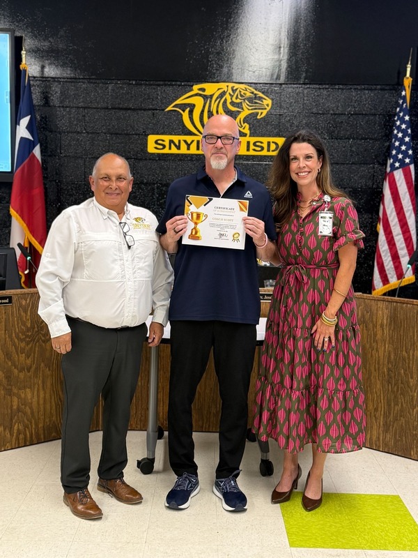 staff and students posting with certificates