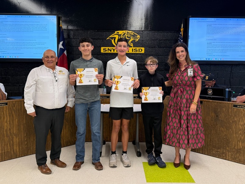 staff and students posting with certificates