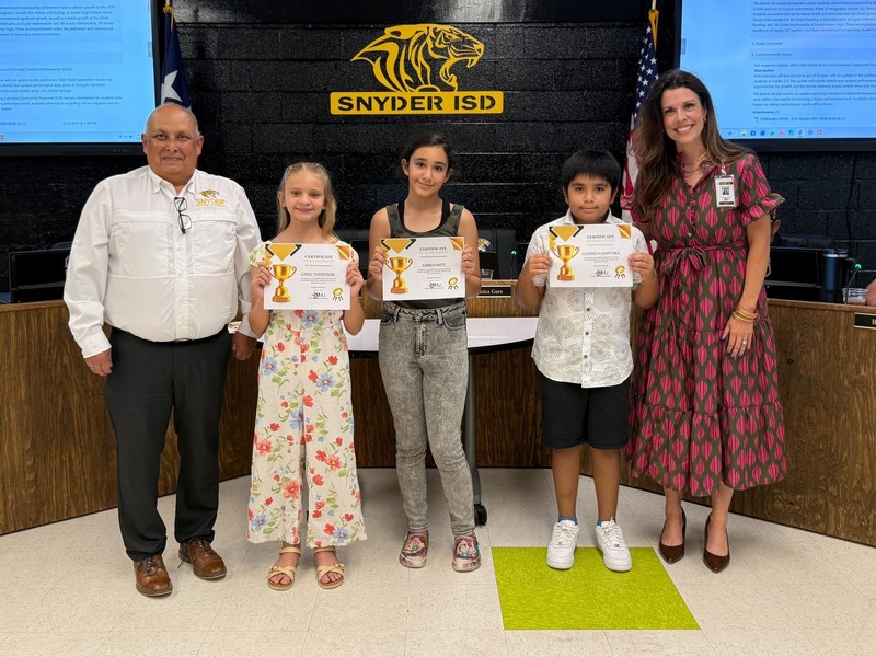 staff and students posting with certificates