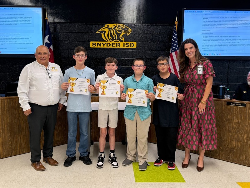 staff and students posting with certificates