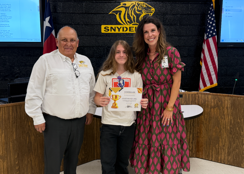 student posing with certificate