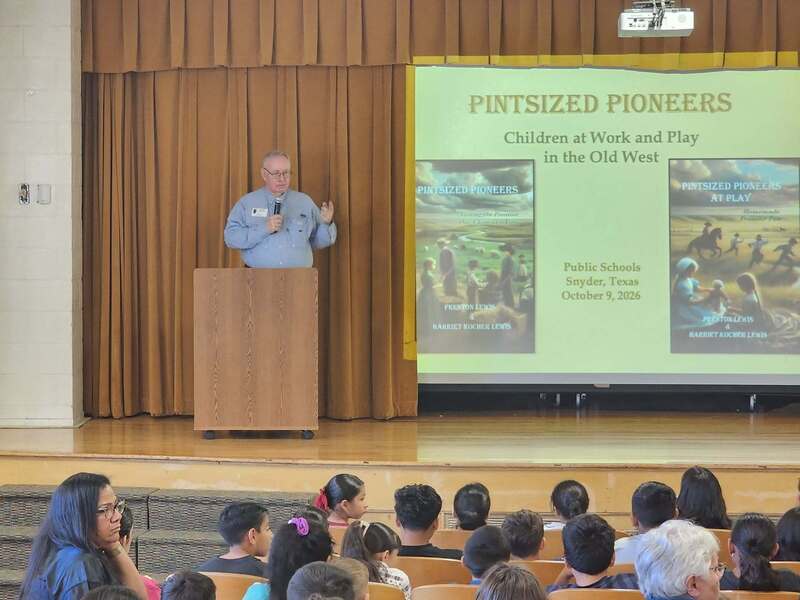 author speaking to students