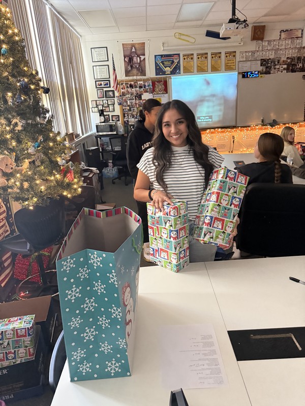 student wrapping present