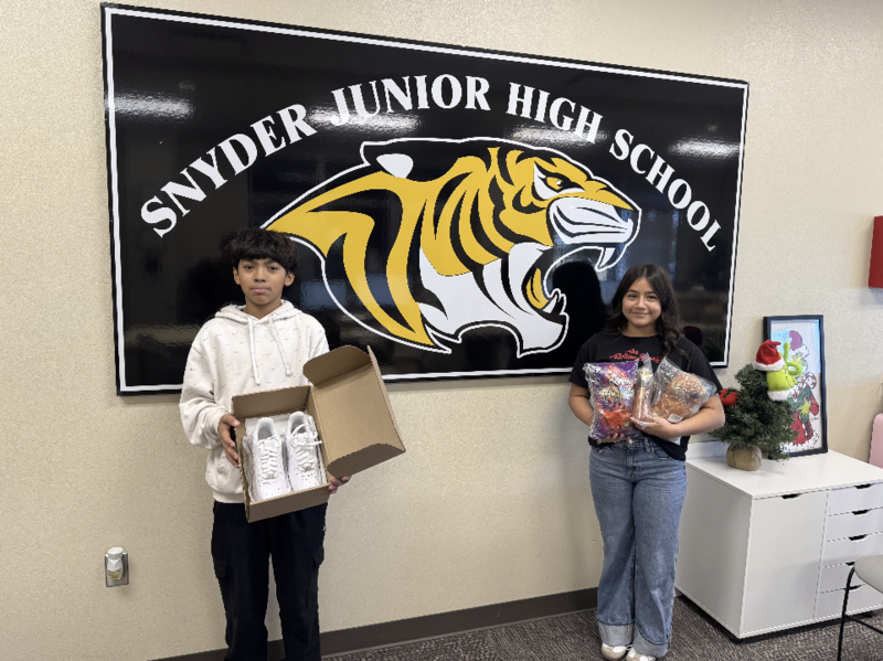 students posing with prizes