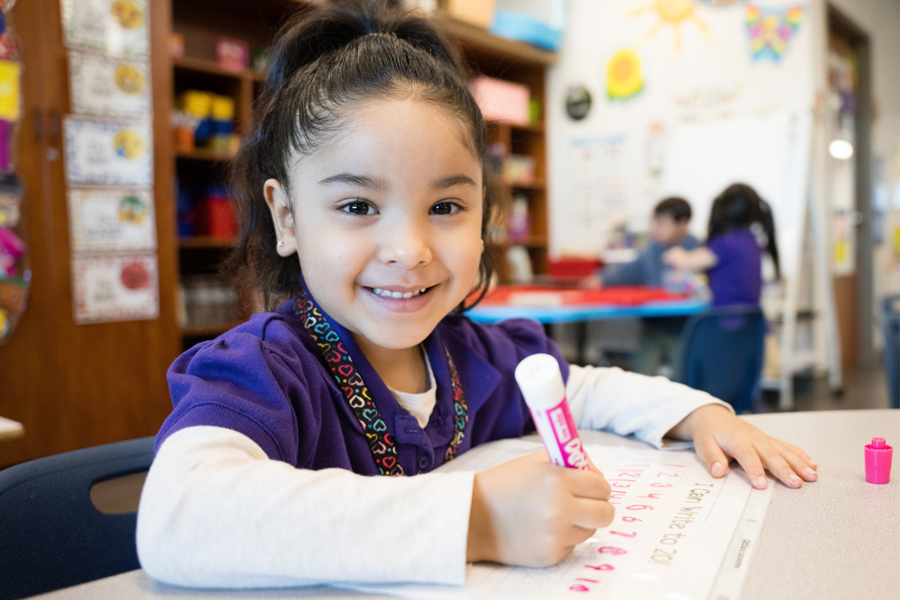 Pre K student smiling