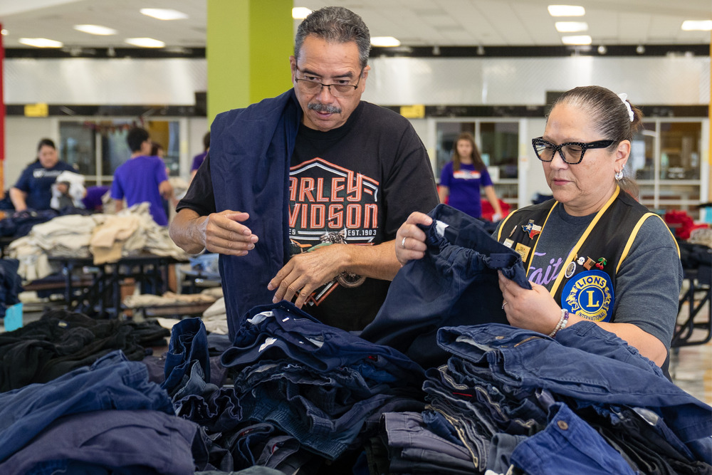 Volunteers gathering uniforms