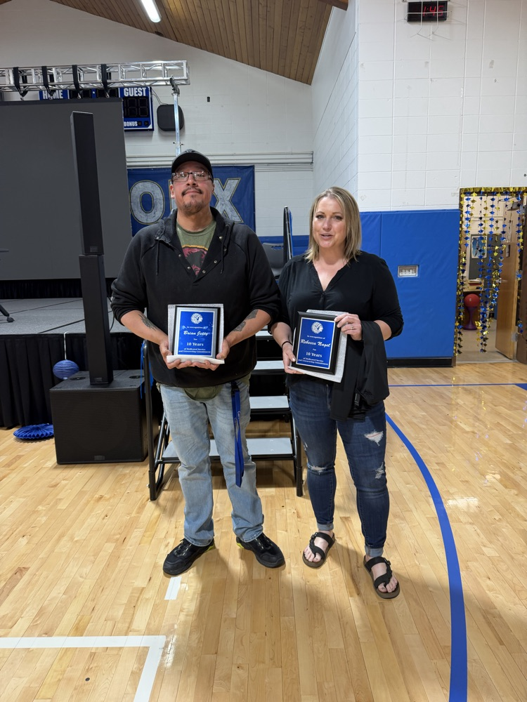 Rebecca Nagel and Brian Jetty were recognized for 10 years of service. Not pictured is Louis DeCouteau, Jr. 