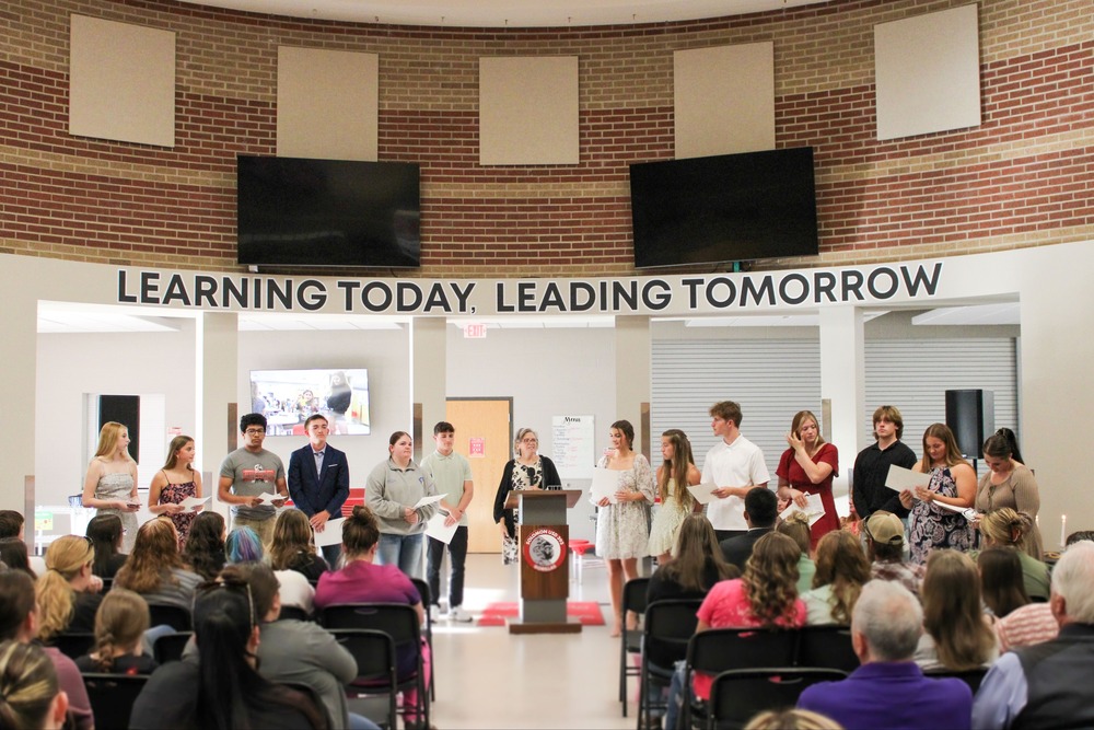 2026 Induction Night with the National Honor Society group standing at the front with their sponsor, Mrs. Tina Jacquart