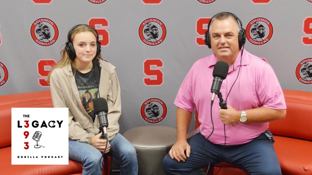 Mackenzie Blair and Justin Coup posing for podcast photo