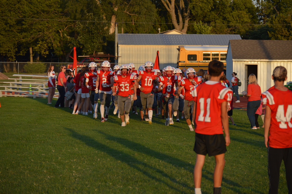 solomon players rushing out to fb field