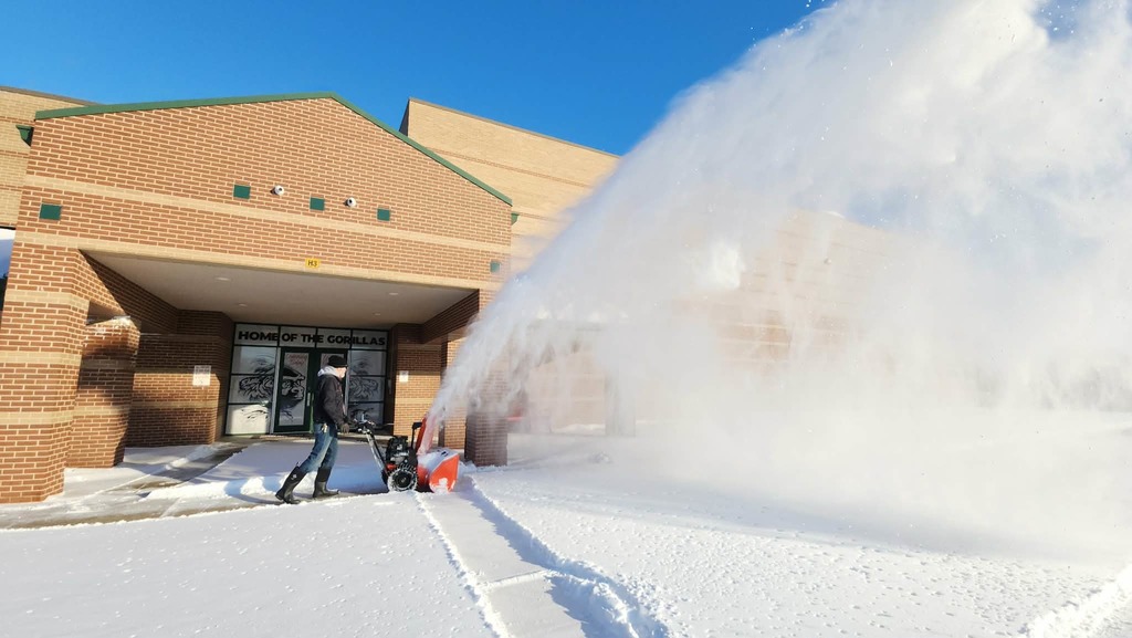 Guy Snow Blowing