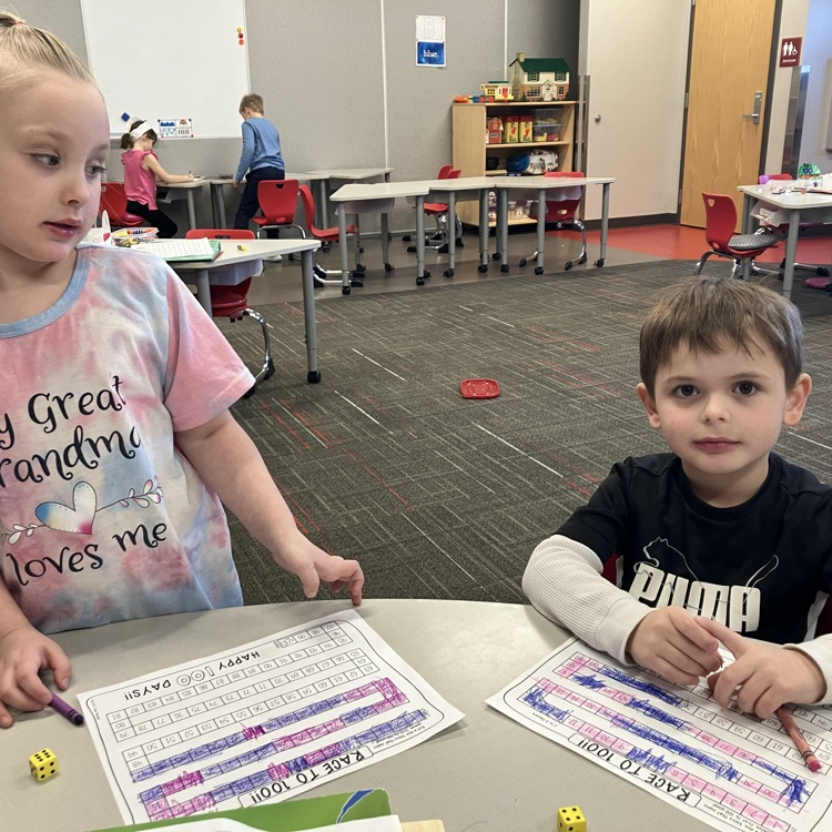 two kids playing race to 100