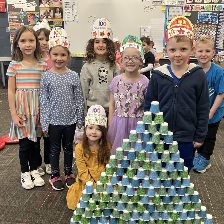kids made a tower with 100 cups