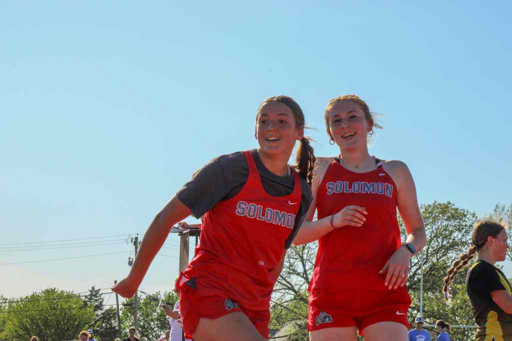 stuents just finished race and smiling at their result