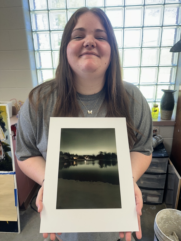 student showcaing art