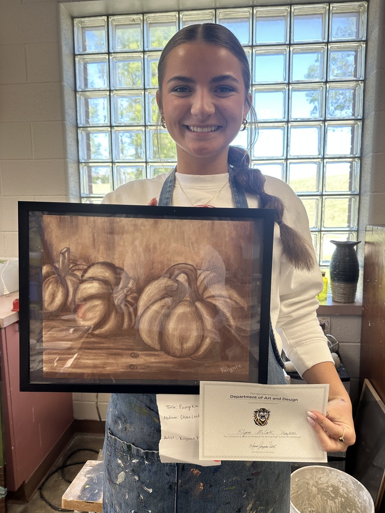 student showcaing art